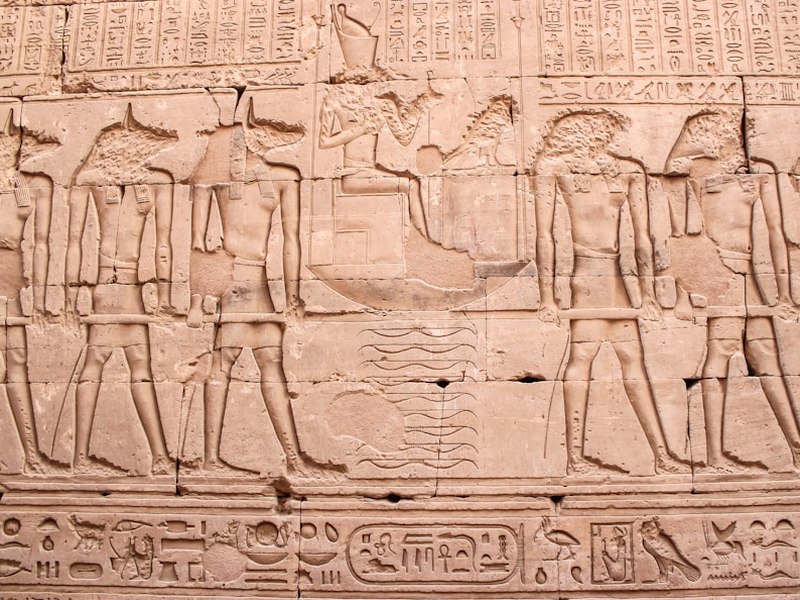 Editorial team reviewing museum floor plans at the Heliopolis desk